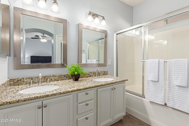 bathroom with vanity, tile patterned floors, shower / bath combination with glass door, and ceiling fan