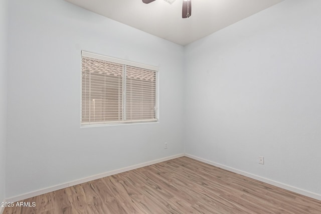 spare room with ceiling fan and light hardwood / wood-style floors