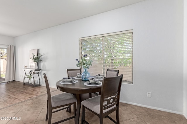 view of tiled dining space