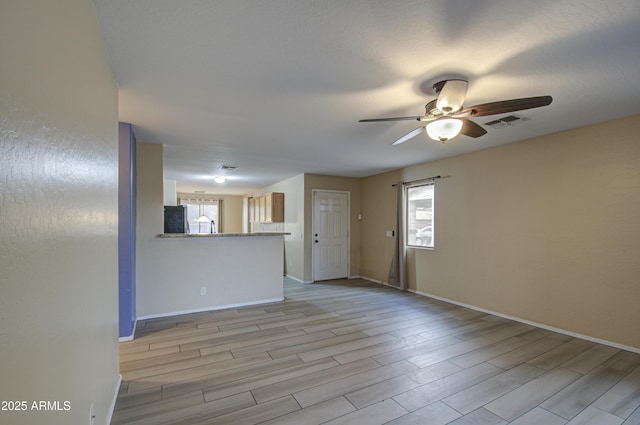 unfurnished room featuring ceiling fan