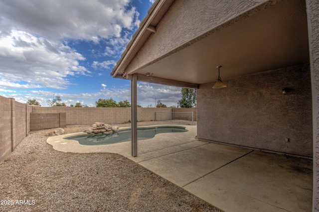 view of patio featuring a fenced in pool