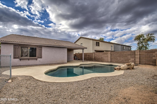 view of swimming pool with a patio