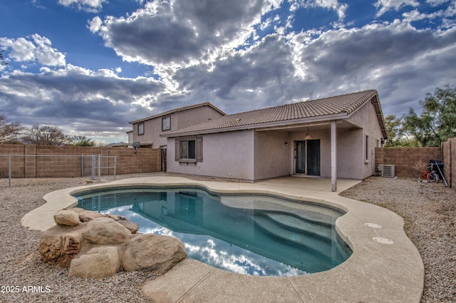 view of pool featuring central AC and a patio