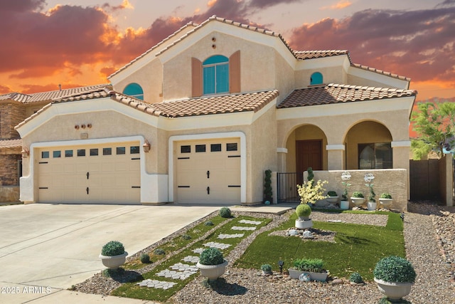 2036 E Carob Dr, Chandler, AZ 85286 - mediterranean / spanish-style home with stucco siding, driveway, a garage, and a tiled roof