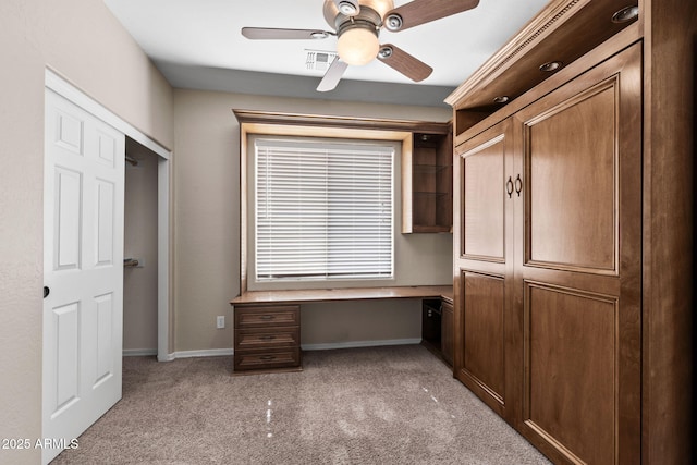 2036 E Carob Dr, Chandler, AZ 85286 - unfurnished office with light carpet, ceiling fan, baseboards, and built in study area