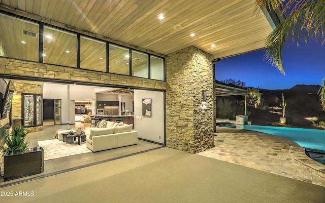 view of patio with an outdoor pool, visible vents, and an outdoor hangout area