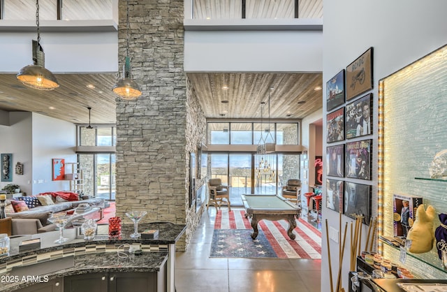 interior space with wood ceiling, billiards, a high ceiling, and recessed lighting