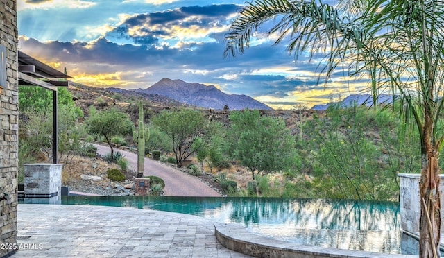 view of pool with a mountain view