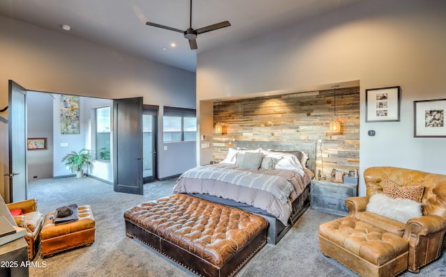 carpeted bedroom with access to outside, high vaulted ceiling, and a ceiling fan