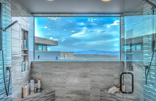 bathroom with a tile shower