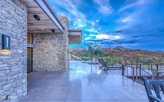 view of patio / terrace with a mountain view