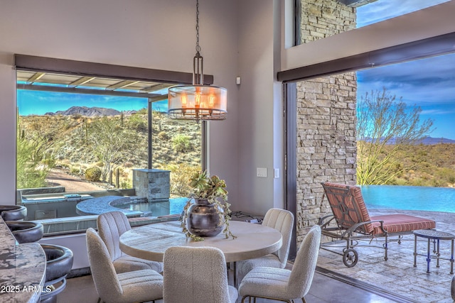 dining space with a towering ceiling