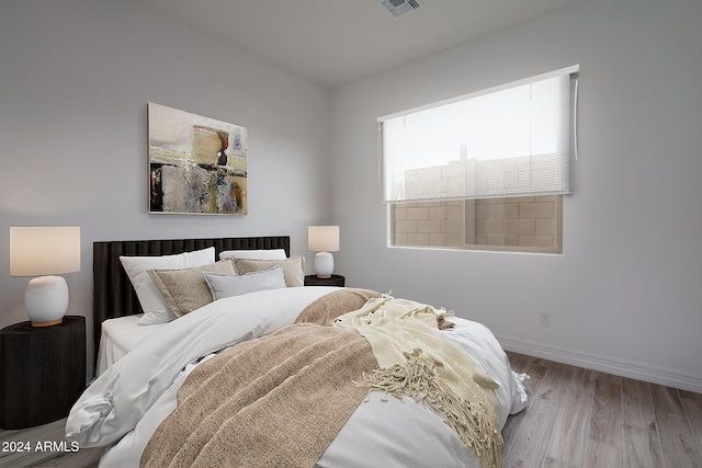 bedroom with light wood-type flooring