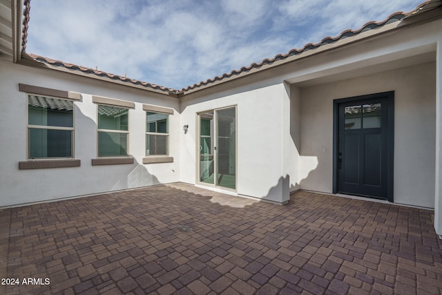 doorway to property featuring a patio