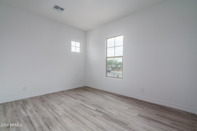 spare room with light wood-type flooring