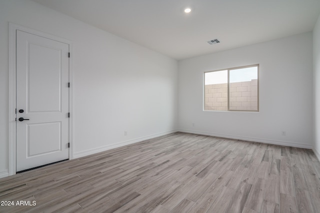 spare room featuring light hardwood / wood-style flooring