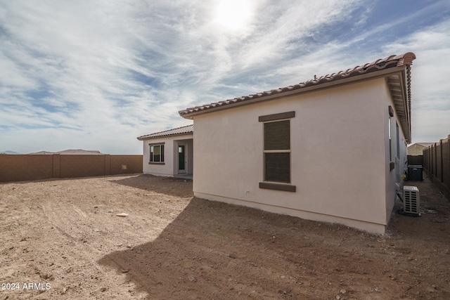 back of property with cooling unit