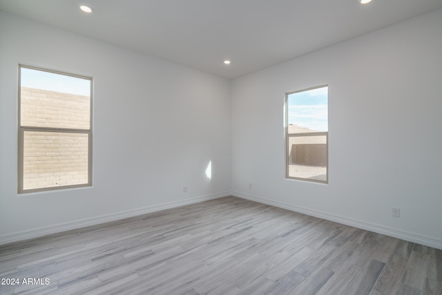 spare room with light hardwood / wood-style flooring