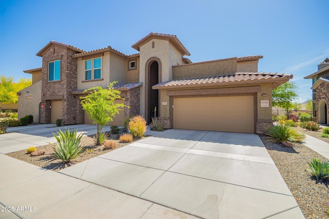 2425 W Bronco Butte Trl Unit 2028, Phoenix, AZ 85085 - mediterranean / spanish house featuring concrete driveway, stone siding, stucco siding, a garage, and a tile roof
