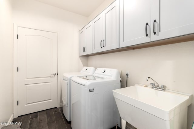 2425 W Bronco Butte Trl Unit 2028, Phoenix, AZ 85085 - washroom featuring washing machine and clothes dryer, cabinet space, and wood finish floors