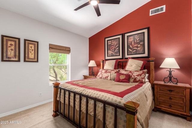 carpeted bedroom featuring vaulted ceiling, baseboards, and a ceiling fan