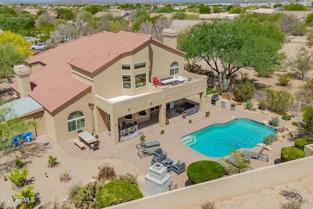 view of pool featuring fence and a patio