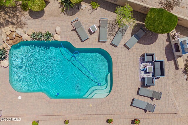 view of swimming pool with a patio