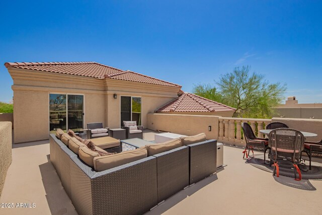 view of patio with outdoor lounge area and outdoor dining area