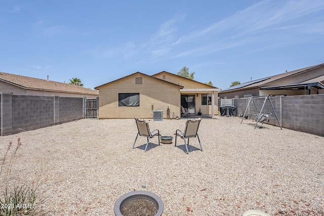 941 E Desert Moon Trl, San Tan Valley, AZ 85143 - back of property featuring a fenced backyard, a patio area, and stucco siding