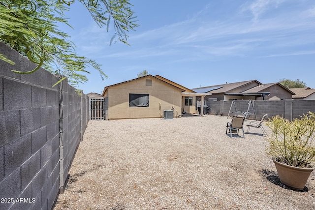 941 E Desert Moon Trl, San Tan Valley, AZ 85143 - rear view of property featuring a fenced backyard and stucco siding