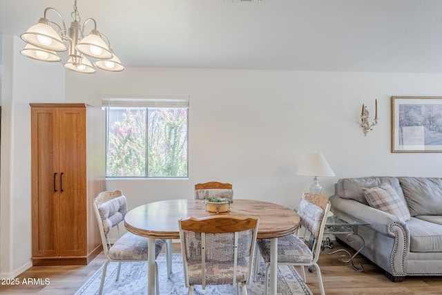 941 E Desert Moon Trl, San Tan Valley, AZ 85143 - dining space featuring a chandelier and light wood-style flooring