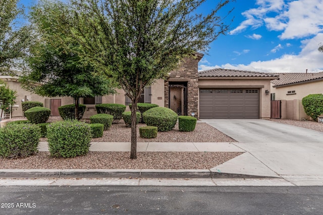 19571 E Strawberry Dr, Queen Creek, AZ 85142 - view of front facade with driveway, fence, an attached garage, a tile roof, and stucco siding