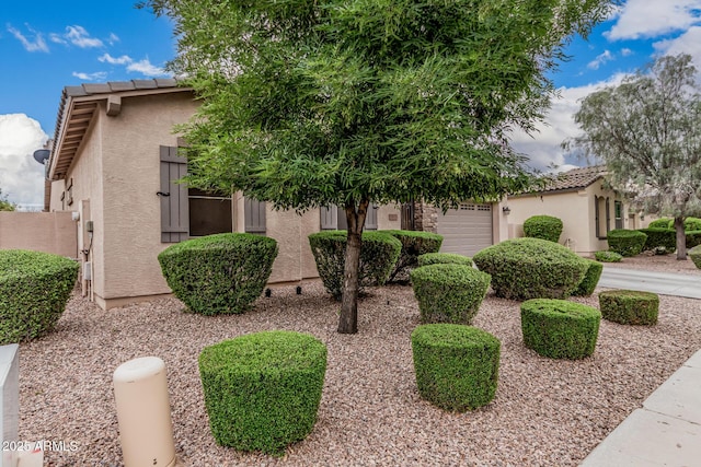 19571 E Strawberry Dr, Queen Creek, AZ 85142 - view of front of home with stucco siding, a tile roof, and an attached garage