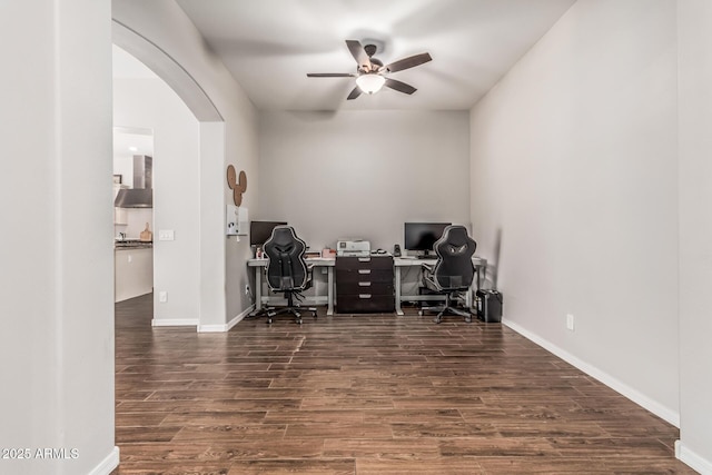 19571 E Strawberry Dr, Queen Creek, AZ 85142 - office space featuring baseboards, wood finished floors, arched walkways, and a ceiling fan