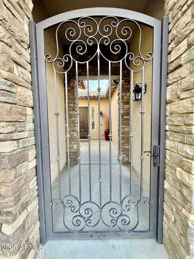 19571 E Strawberry Dr, Queen Creek, AZ 85142 - property entrance with stone siding and a gate