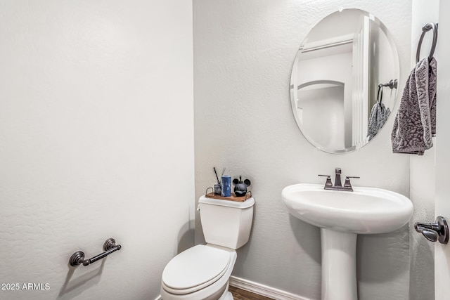 19571 E Strawberry Dr, Queen Creek, AZ 85142 - half bath with baseboards, toilet, a textured wall, and a sink