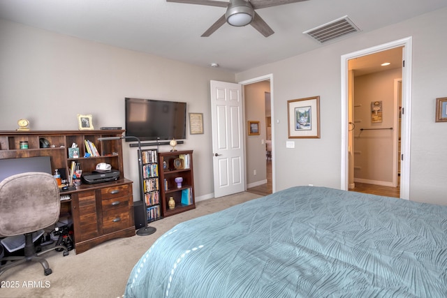 carpeted bedroom featuring visible vents, baseboards, and a ceiling fan