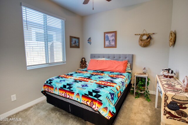 bedroom featuring baseboards, carpet floors, and ceiling fan