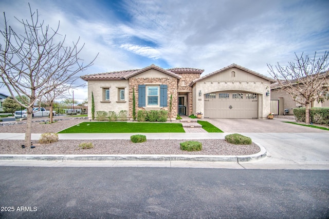 mediterranean / spanish house featuring driveway, an attached garage, stucco siding, a front lawn, and a tiled roof