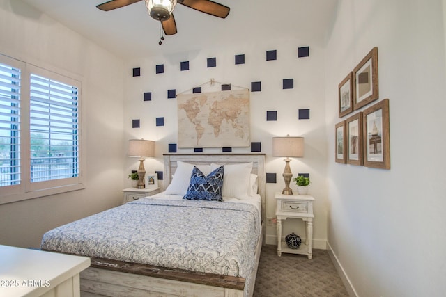 carpeted bedroom featuring a ceiling fan and baseboards