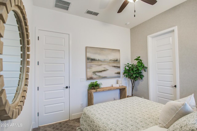 bedroom featuring visible vents, dark carpet, baseboards, and ceiling fan