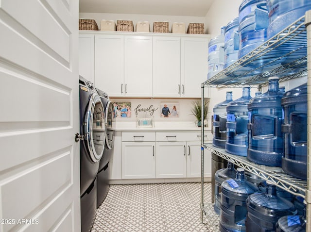 laundry area featuring cabinet space and independent washer and dryer