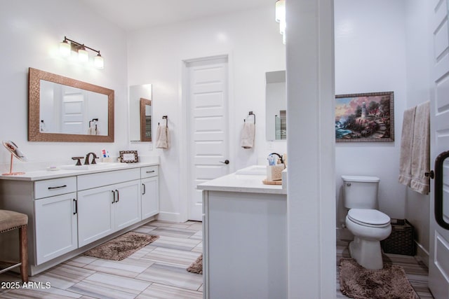 full bathroom featuring vanity and toilet