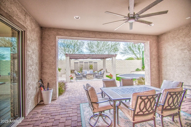 view of patio / terrace with ceiling fan, fence, outdoor lounge area, outdoor dining area, and a pergola