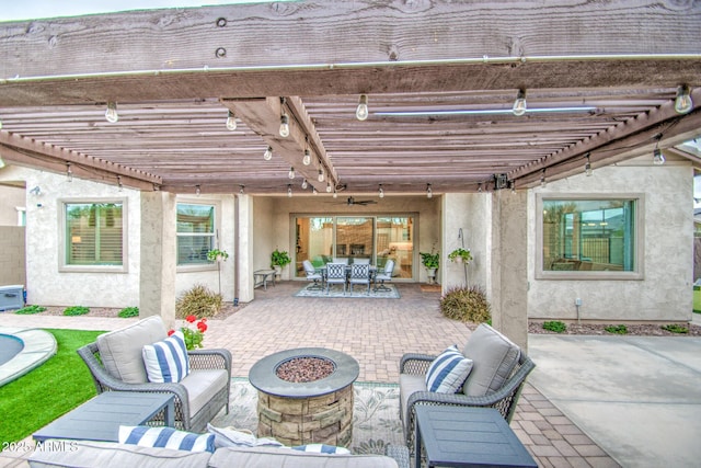 view of patio with outdoor dining area, an outdoor living space with a fire pit, and a pergola