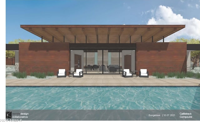 rear view of house with an outdoor pool and a patio