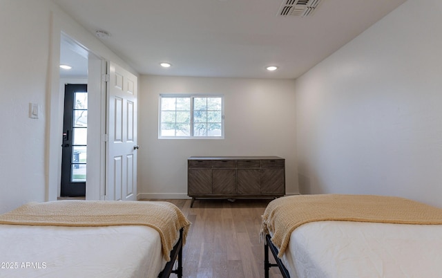 bedroom featuring wood-type flooring