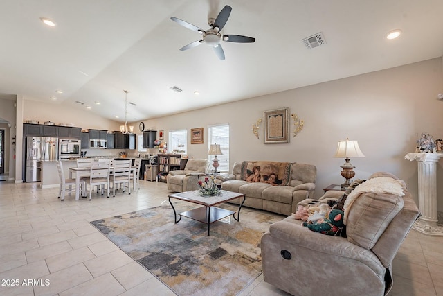 tiled living room with ceiling fan and vaulted ceiling