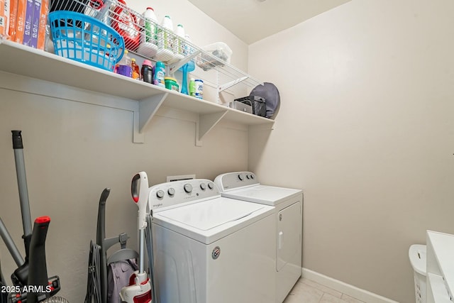 washroom featuring light tile patterned floors and independent washer and dryer