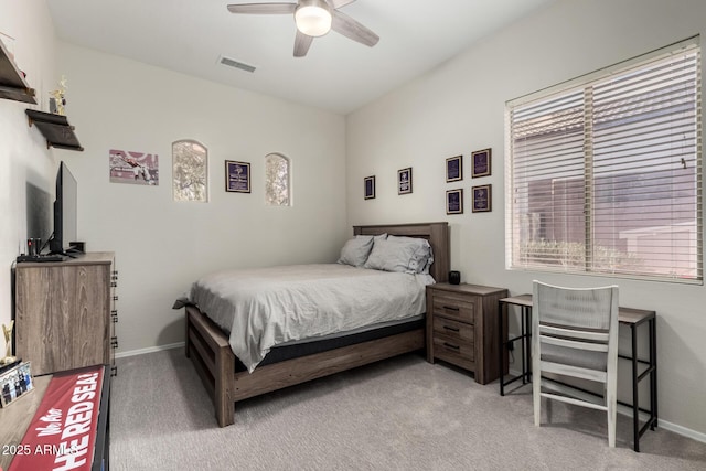 bedroom featuring ceiling fan and light carpet